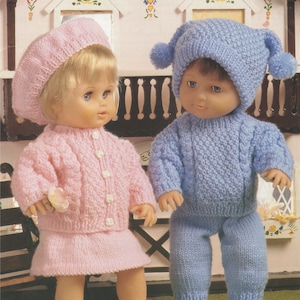 May include: Two dolls dressed in knitted outfits. One doll wears a pink beret, sweater, skirt, and booties. The other doll is in a blue knit hat with pom-poms, a sweater, and pants. The text at the bottom reads "FOR DOLLS AND PREMATURE BABIES."