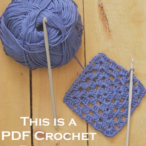 May include: A close-up of a blue crochet square with two crochet hooks and a ball of blue yarn on a wooden surface. The text "This is a PDF Crochet Pattern" is written below the square.