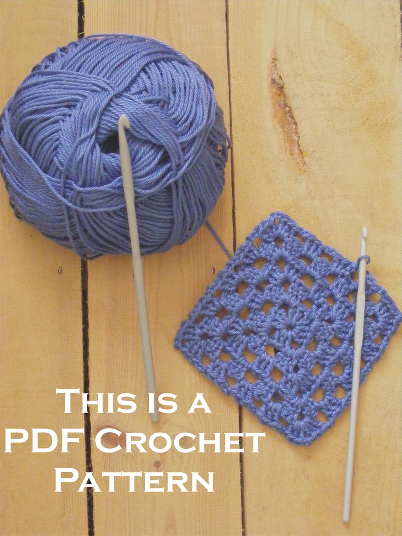 May include: A close-up of a blue crochet square with two crochet hooks and a ball of blue yarn on a wooden surface. The text "This is a PDF Crochet Pattern" is written below the square.