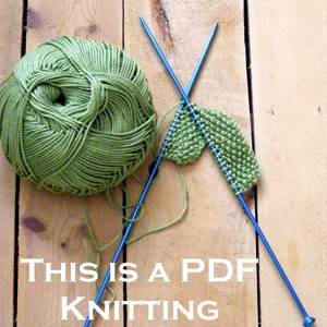 May include: A green ball of yarn with two blue knitting needles and a small green knitted piece. The text "THIS IS A PDF KNITTING PATTERN" is written below the yarn and needles.