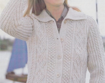 May include: A white knitted cardigan with a cable knit pattern and button closure. The cardigan has a collar and long sleeves.