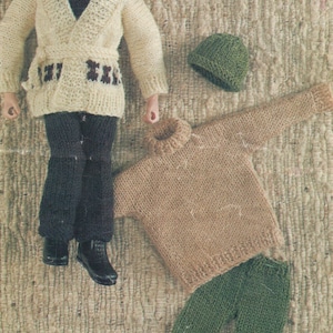 May include: A set of knitted doll clothes, including a brown sweater, green pants, a white cardigan with a brown belt, and a green hat.