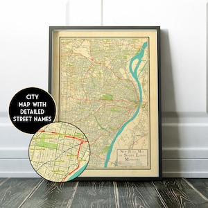 May include: Vintage map of Saint Louis, Missouri, with detailed street names. The map is printed in brown, green, and blue on a cream-colored background. The map is framed in a black frame.
