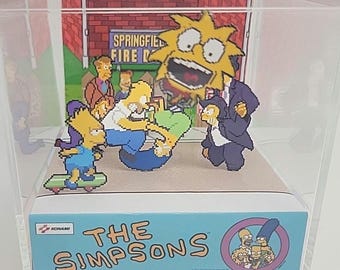 Cubo de exhibición de dioramas del videojuego arcade de Los Simpson