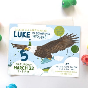 May include: A blue and green birthday invitation with a cartoon bald eagle wearing a party hat and holding a fish. The invitation says "Calling all party eagles! Luke is soaring into five!" and includes the date and time of the party.