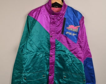 May include: A multi-colored satin jacket with a teal, purple, and blue color scheme. The jacket has a zipper closure and a large "Babice Fly" logo on the right side.
