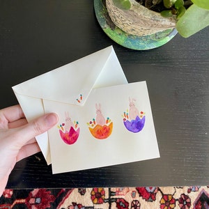 Carte aquarelle peinte à la main de lapins de Pâques