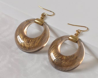 doorknocker style lightweight hoops, gold flecked resin drop hoops, front facing medium hoops, opaque dangle earrings