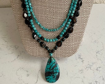 Black River, 3 strand Banded Black Agate, Golden sheen Obsidian rounds, Turquoise, Delica Glass spacers and a silver filled toggle clasp