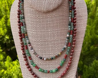 Earth Tones. 3 strand necklace of Fancy Jasper, Green Aventurine, Red Jasper and Red Picture Jasper. Silver filled slide and lock clasp.