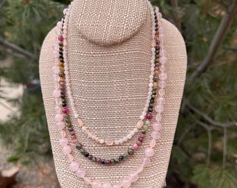 Cosmos. 3 strand necklace of Agates, Mixed Tourmaline, Pink Chalcedony, Rose Quartz and a Silver filled toggle clasp. Long strand is 21".
