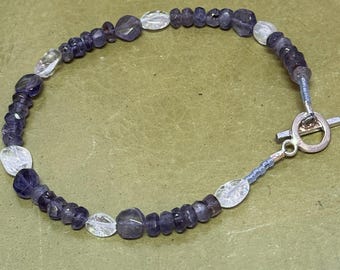 Iolite facets with Clear Quartz ovals 8 inch bracelet. Sterling Silver toggle clasp