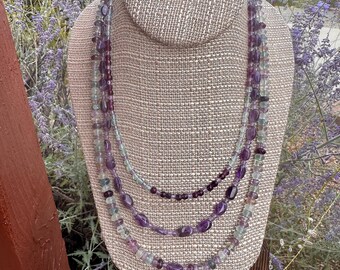 Royal Colors. 3 strand Amethyst and Rainbow Fluorite necklace with fancy slide and lock clasp. 21 inches. February's birthstone