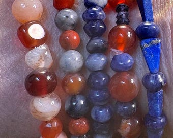 New York Knicks beaded gemstone bracelets. 3 elastic Friendship bracelets. 2 have silver filled toggle clasps. Red Agate, Sodalite and Lapis