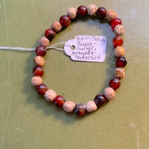 Red Agate and Picture Jasper Energy bracelet on elastic.  Fits up to a 7 1/4 inch wrist. Courage, strength and protection.
