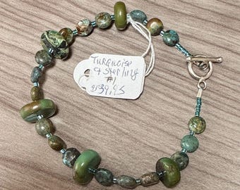 Turquoise Coins and Discs 7 1/4" bracelet. Sterling Silver toggle clasp. Delica Glass spacer beads. December's birthstone. Unisex bracelet.