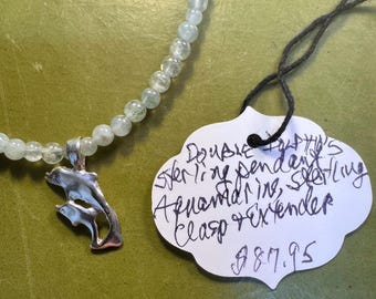 Double Dolphins 90's Sterling Double Dolphin pendant from Captain Smith strung on 3mm Aquamarine round beads. Sterling extension and clasp