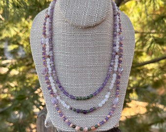 Garden Party, 3 strand necklace of Amethyst, Moss Agate, Quartz Crystal, Red Aventurine and Rose Jasper. Silver filled slide and lock clasp.