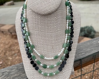 Cinco de Mayo Hail. 3 strand necklace of Cultured Pearls, Black Tourmaline, Green Aventurine, Picasso Serpentine and silver filled toggle