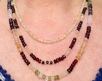 Five Gems. 3 strands Citrine, Clear Quartz, Garnet, Iolite and Peridot faceted Rondelles. 20 3/4 inches. Sterling Silver toggle clasp.