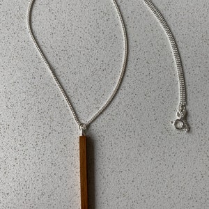 Simple elegant wooden pendant necklace, Iroko wood on a 925 sterling silver chain.