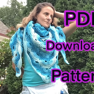 May include: A woman wearing a blue and white crocheted shawl with the text "PDF Download Pattern" in large purple letters.