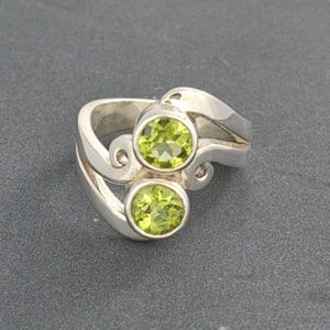 Silver ring peridots