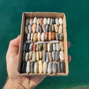 70 elongated,natural,colorful,smooth, beach pebbles.Rare,genuine volcanic beach stones.Finger stones