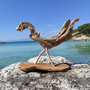 One-of-a-kind driftwood rooster sculpture on stand.Beach bird