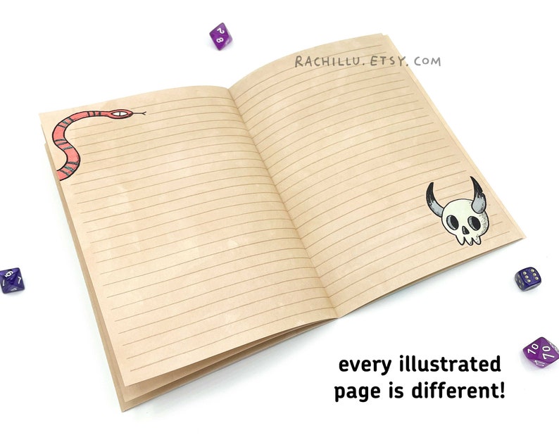 May include: An open notebook with lined pages. The front cover has a red snake illustration and the back cover has a black and white skull illustration. The text "RACHILLU.ETSY.COM" is printed on the back cover. The text "every illustrated page is different!" is printed below the notebook.
