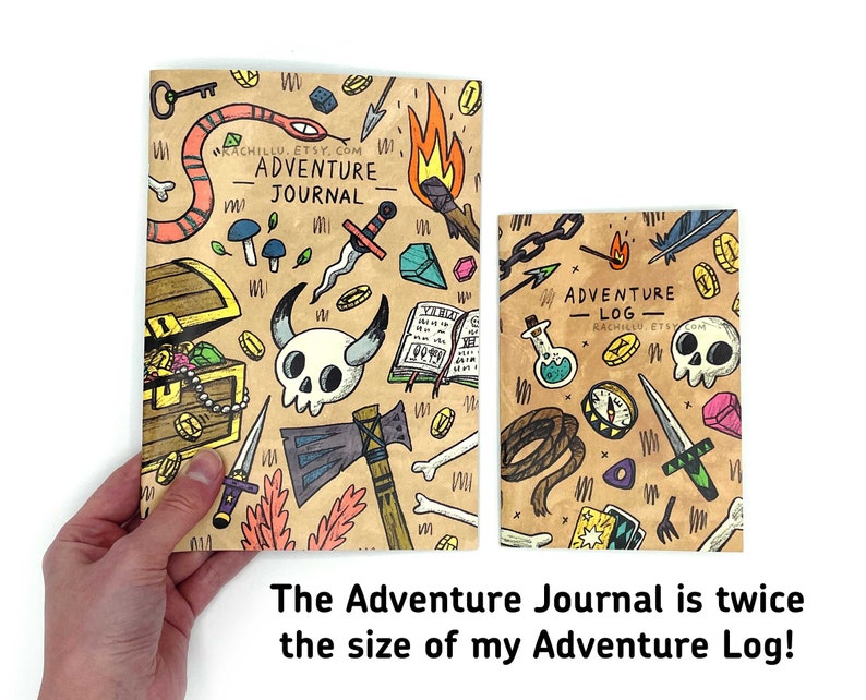 May include: Two adventure journals with illustrated covers. The larger journal is titled "Adventure Journal" and the smaller journal is titled "Adventure Log". Both journals feature a brown background with colorful illustrations of fantasy and adventure items.
