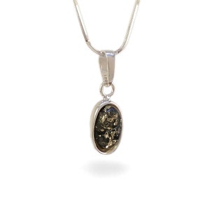 May include: A silver chain necklace with a pendant featuring a dark green oval-shaped stone.