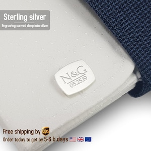 May include: Sterling silver cufflinks with the initials "N&G" and the date "05.25.19" engraved on a rectangular silver plate.