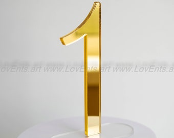 Elegant gold mirror table numbers for a luxury wedding. Bright mirror acrylic sign for table centerpieces.  Festive decor for guest tables.