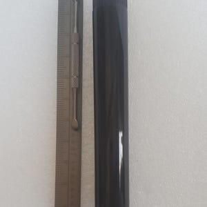 May include: A trio of ceramic mugs with a speckled, matte finish in cream, light grey, and dark grey. Each mug features a simple, minimalist design, ideal for tea or coffee.