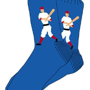 May include: A pair of blue socks with a baseball player graphic on each sock. The player is wearing a white uniform with red accents and is holding a bat.
