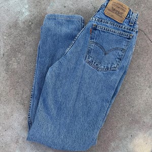 Vintage Levis 10912-0766, High rise medium wash Levis, orange tab slim fit tapered leg 90s 1990s