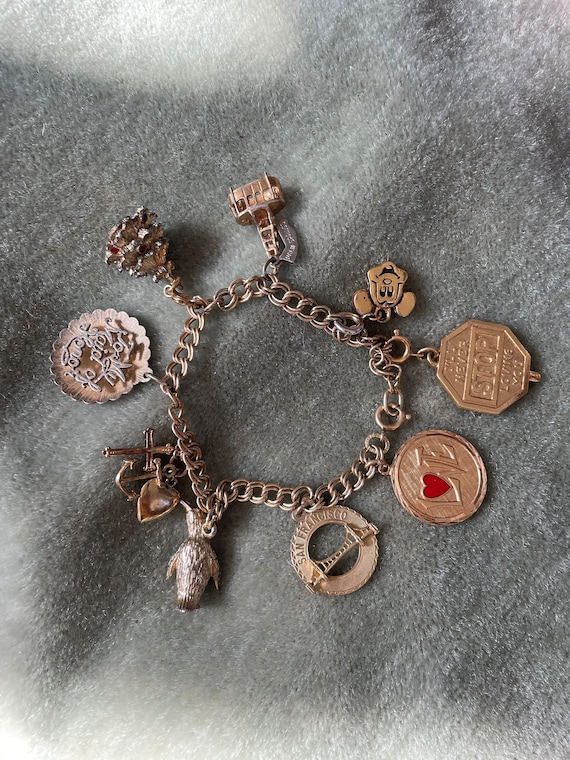 Vintage Charm bracelet, 1970s GF nine charm brace… - image 1