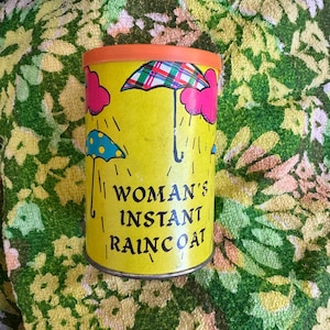 Vintage Woman&#39;s Instant Raincoat in a can never opened, The chest originals Los Angeles 60s 70s