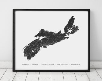 May include: Black and white map print of Nova Scotia, Canada. The map shows the province's coastline and major rivers. The names of the province in English and French are listed below the map: Mi'kmaq, L'Acadie, Nouvelle-Écosse, New Scotland, Nova Scotia.