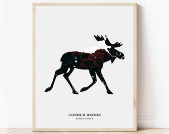 May include: A black and white moose silhouette with red lines inside, representing the streets of Corner Brook, Newfoundland, Canada. The text "CORNER BROOK 48.9490° N, 57.9933° W" is below the moose.