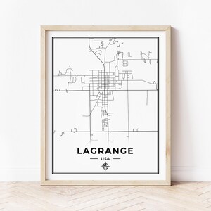 May include: A black and white line art map of LaGrange, USA. The map shows the city's streets and roads. The city name is printed below the map, along with a compass rose.