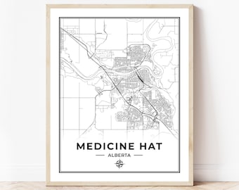 May include: Black and white line art map of Medicine Hat, Alberta, Canada. The map is framed in a light wood frame.