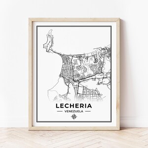May include: Black and white line art map print of the city of Lecheria, Venezuela. The map shows the city's streets, buildings, and coastline. The city name and country are printed below the map.