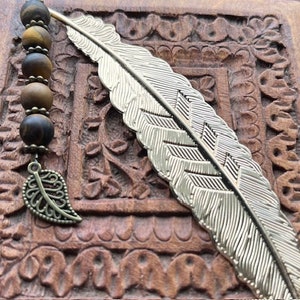 Healing Stone Bookmark with matte tigers eye stones and leaf charm; light gold feather.Great gift for book lovers!