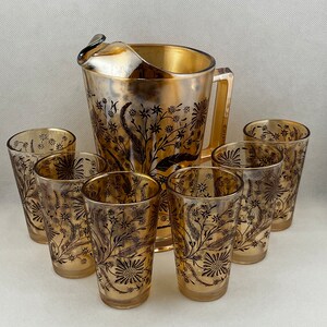 Vintage Jeanette Marigold Carnival Glass Iridescent with dark floral pattern -  Pitcher and 6 glasses