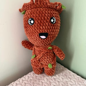 May include: A set of three ceramic vases in varying heights and shapes. The vases are glazed in a matte white finish, offering a minimalist aesthetic. The tallest vase is approximately 10 inches high.