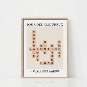 May include: A beige printable poster with the text "JOUR DES AMOUREUX" in black. The poster features a scrabble tile design spelling out "LOVE" and "HUGS" with a red heart in the center. The text "JOYEUSE SAINT-VALENTIN" and "THE LOVE LANGUAGE COLLECTION XII" is at the bottom of the poster.