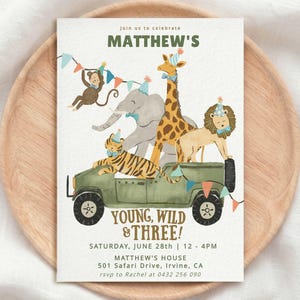 May include: A rectangular invitation card featuring a watercolor illustration of a green safari jeep carrying a tiger, elephant, giraffe, lion, and monkey wearing party hats. Text reads: Matthew's Young, Wild & Three! June 28th, 12-4 PM, 501 Safari Drive.