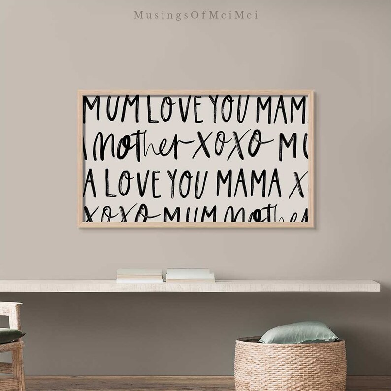 May include: A framed print with black text on a white background. The text reads "MUM LOVE YOU MAM Mother Xoxo MI A LOVE YOU MAMA X Xoxo MUM Mother".